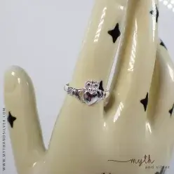 Claddagh ring shown on ceramic hand